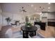 Bright open-concept space with an archway and modern decor, fireplace and a wine cellar at 8104 Bay Harbor Dr, Las Vegas, NV 89128