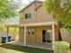The backyard is complimented with new turf and a covered patio to relax at 8550 Bright Bush St, Las Vegas, NV 89131