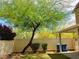 Lovely backyard featuring well-maintained landscaping, shade tree, covered patio, and privacy fence at 8550 Bright Bush St, Las Vegas, NV 89131