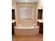 A luxurious bathroom with a large soaking tub, dual vanities, and a window for natural light, creating a spa-like experience at 8550 Bright Bush St, Las Vegas, NV 89131