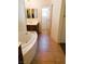 Well-designed bathroom showcases a soaking tub with modern fixtures, a spacious vanity, and tile flooring for a clean, fresh look at 8550 Bright Bush St, Las Vegas, NV 89131