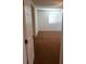 A bright bedroom featuring plush carpet, a ceiling fan, and a large window that provides plenty of natural light at 8550 Bright Bush St, Las Vegas, NV 89131