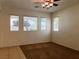 A bedroom with three windows and carpet providing ample natural light at 8550 Bright Bush St, Las Vegas, NV 89131