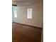 A bright bedroom featuring plush carpet and windows with blinds, creating a comfortable private space at 8550 Bright Bush St, Las Vegas, NV 89131