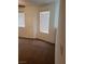 Bedroom featuring neutral paint, brown carpet, and two windows with blinds at 8550 Bright Bush St, Las Vegas, NV 89131