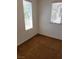 Well lit bedroom showing two windows and neutral colored carpeting at 8550 Bright Bush St, Las Vegas, NV 89131