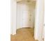 This bright entryway features tile floors, white walls and a white front door, offering a welcoming atmosphere at 8550 Bright Bush St, Las Vegas, NV 89131