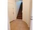 Entryway with tile flooring, a white front door, and a staircase at 8550 Bright Bush St, Las Vegas, NV 89131