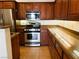 A kitchen featuring stainless steel appliances, wood cabinets, and granite countertops at 8550 Bright Bush St, Las Vegas, NV 89131