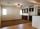A living room with carpet, a ceiling fan, and built-in cabinets and shelves at 8550 Bright Bush St, Las Vegas, NV 89131