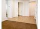 This living room features neutral tile floors, bright white walls, and multiple doorways leading to other rooms at 8550 Bright Bush St, Las Vegas, NV 89131