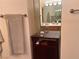 Bathroom featuring a mirrored vanity and cabinet for storage at 87 E Agate Ave # 202, Las Vegas, NV 89123