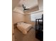 Bedroom featuring a ceiling fan, window with blinds, and a queen-size bed at 87 E Agate Ave # 202, Las Vegas, NV 89123