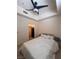 Bedroom with bed, white linens, ceiling fan, and closet at 87 E Agate Ave # 202, Las Vegas, NV 89123