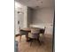 This stylish dining area features a round wooden table with four comfortable chairs, perfect for meals or meetings at 87 E Agate Ave # 202, Las Vegas, NV 89123