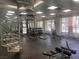 Bright gym featuring cardio and strength training equipment with an adjacent indoor pool view at 87 E Agate Ave # 202, Las Vegas, NV 89123
