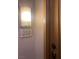 Apartment 202 door entrance with wall sconce lighting at 87 E Agate Ave # 202, Las Vegas, NV 89123
