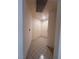 Inviting hallway with neutral walls and tiled flooring leading to two doors at 87 E Agate Ave # 202, Las Vegas, NV 89123