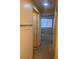 Hallway that leads to a bedroom featuring carpet flooring and an open-door entry at 87 E Agate Ave # 202, Las Vegas, NV 89123