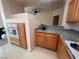 View of kitchen with built in oven, granite counters, and overhead light at 87 E Agate Ave # 202, Las Vegas, NV 89123