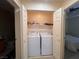 Laundry closet with stacked washer and dryer saves space while providing convenient laundry solutions at 87 E Agate Ave # 202, Las Vegas, NV 89123