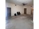 Neutral living room featuring carpet, ceiling fan, and ample open space at 87 E Agate Ave # 202, Las Vegas, NV 89123
