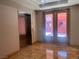 Condo lobby with elevator and doors leading outside at 87 E Agate Ave # 202, Las Vegas, NV 89123