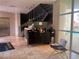 Elegant lobby featuring a beverage station, staircase, and stylish decor at 87 E Agate Ave # 202, Las Vegas, NV 89123