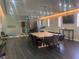 Spacious lounge area with large dining table, comfortable seating, and modern lighting at 87 E Agate Ave # 202, Las Vegas, NV 89123