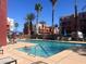 The outdoor pool is framed by residential buildings and palm trees at 87 E Agate Ave # 202, Las Vegas, NV 89123