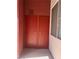 Double door storage on the balcony with light from a window, ideal for storage solutions at 87 E Agate Ave # 202, Las Vegas, NV 89123