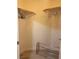 Spacious walk-in closet with hanging rods for ample storage at 87 E Agate Ave # 202, Las Vegas, NV 89123