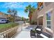Inviting balcony with wrought iron railing and patio furniture, perfect for enjoying the neighborhood view at 9078 Hilverson Ave, Las Vegas, NV 89148