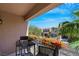 Enjoy the view from this cozy balcony with outdoor seating and floral accents at 9078 Hilverson Ave, Las Vegas, NV 89148