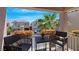 Relaxing balcony featuring comfortable seating and vibrant flower boxes with a pleasant view at 9078 Hilverson Ave, Las Vegas, NV 89148