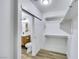 Walk-in closet leading to powder room with a floating vanity at 9078 Hilverson Ave, Las Vegas, NV 89148
