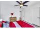 Bedroom with wood-look flooring, ceiling fan, a closet, and a wooden dresser at 9078 Hilverson Ave, Las Vegas, NV 89148