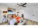 Comfortable bedroom featuring a decorative ceiling fan, bedside lamps, and neutral decor at 9078 Hilverson Ave, Las Vegas, NV 89148