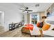 Bedroom featuring a balcony, ceiling fan, wood look floors and decorative touches at 9078 Hilverson Ave, Las Vegas, NV 89148