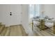 Cozy dining space near the front door featuring a modern table set and stylish decor accents at 9078 Hilverson Ave, Las Vegas, NV 89148