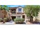 Attractive two-story home with a balcony, well-maintained landscaping, and a welcoming entrance at 9078 Hilverson Ave, Las Vegas, NV 89148