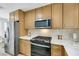 Well-equipped kitchen with stainless steel appliances, sleek countertops, and ample cabinet space at 9078 Hilverson Ave, Las Vegas, NV 89148