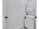 Laundry closet featuring a stacked washer and dryer at 9078 Hilverson Ave, Las Vegas, NV 89148
