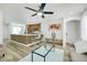 Inviting living room and kitchen area featuring an open layout with stylish decor and plenty of seating at 9078 Hilverson Ave, Las Vegas, NV 89148