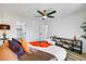 Bright main bedroom with ceiling fan, walk-in closet, wood flooring and modern decor at 9078 Hilverson Ave, Las Vegas, NV 89148