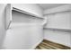 White walk-in closet with wood flooring and shelving at 9078 Hilverson Ave, Las Vegas, NV 89148