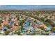 Residential aerial view of the neighborhood with a blue house featuring a pool and RV parking at 9436 Darwell Dr, Las Vegas, NV 89117