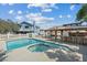 Home's backyard features a pool, gazebo, outdoor kitchen, and plenty of patio space at 9436 Darwell Dr, Las Vegas, NV 89117