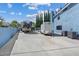 Wide driveway that leads to a pool with parked trailers in backyard at 9436 Darwell Dr, Las Vegas, NV 89117