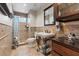 Bathroom featuring tiled shower and flooring, vanity with countertop, and elegant fixtures at 9436 Darwell Dr, Las Vegas, NV 89117